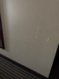 Walls banged, stained, floors stained… very rough.
