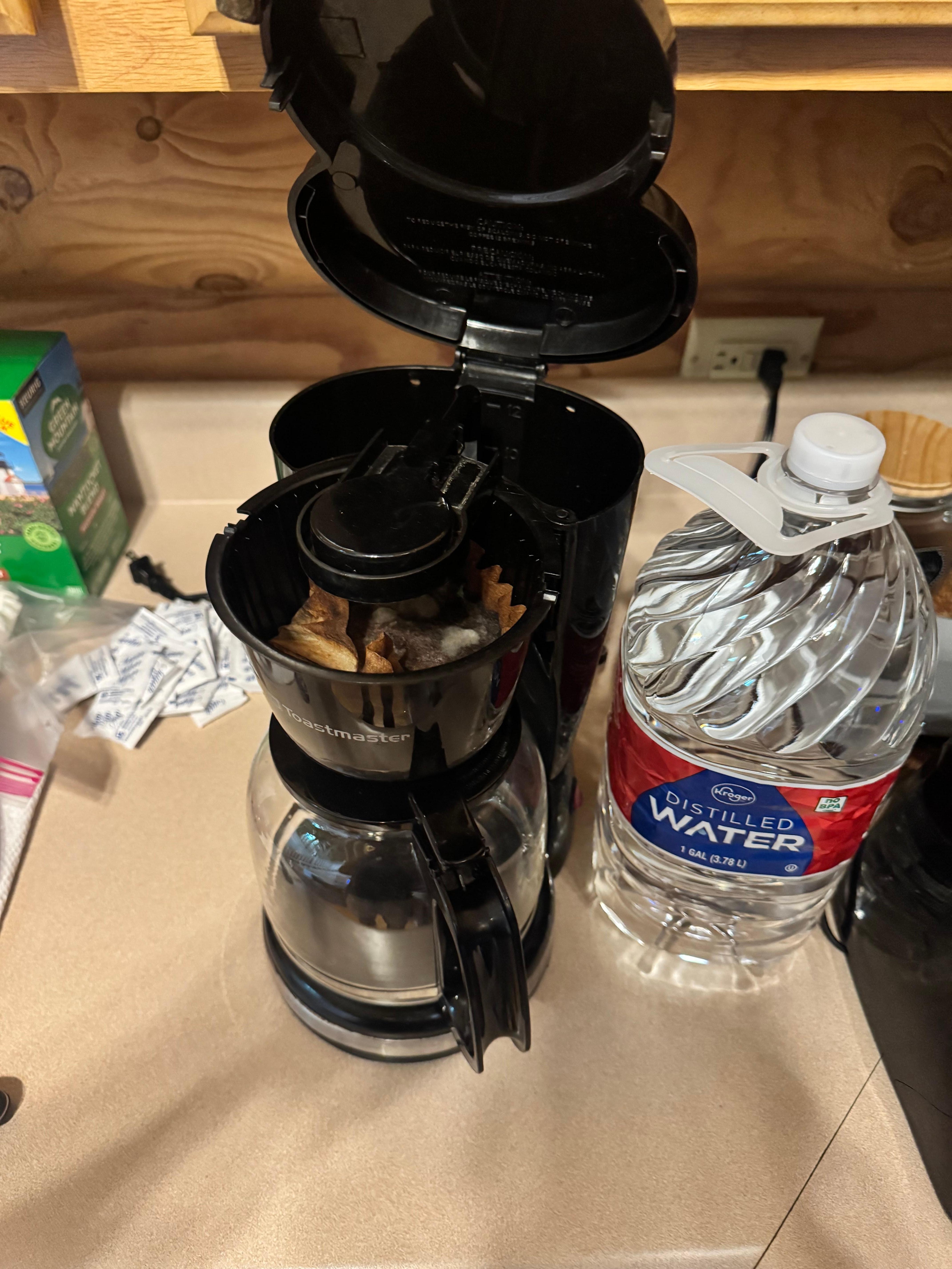 Molded coffee grounds and filter in coffee pot