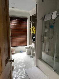 Looking into the bathroom. Door does not fully latch closed.