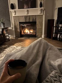 Cozy fireplace and living room for morning reading time. So refreshing and beautiful.