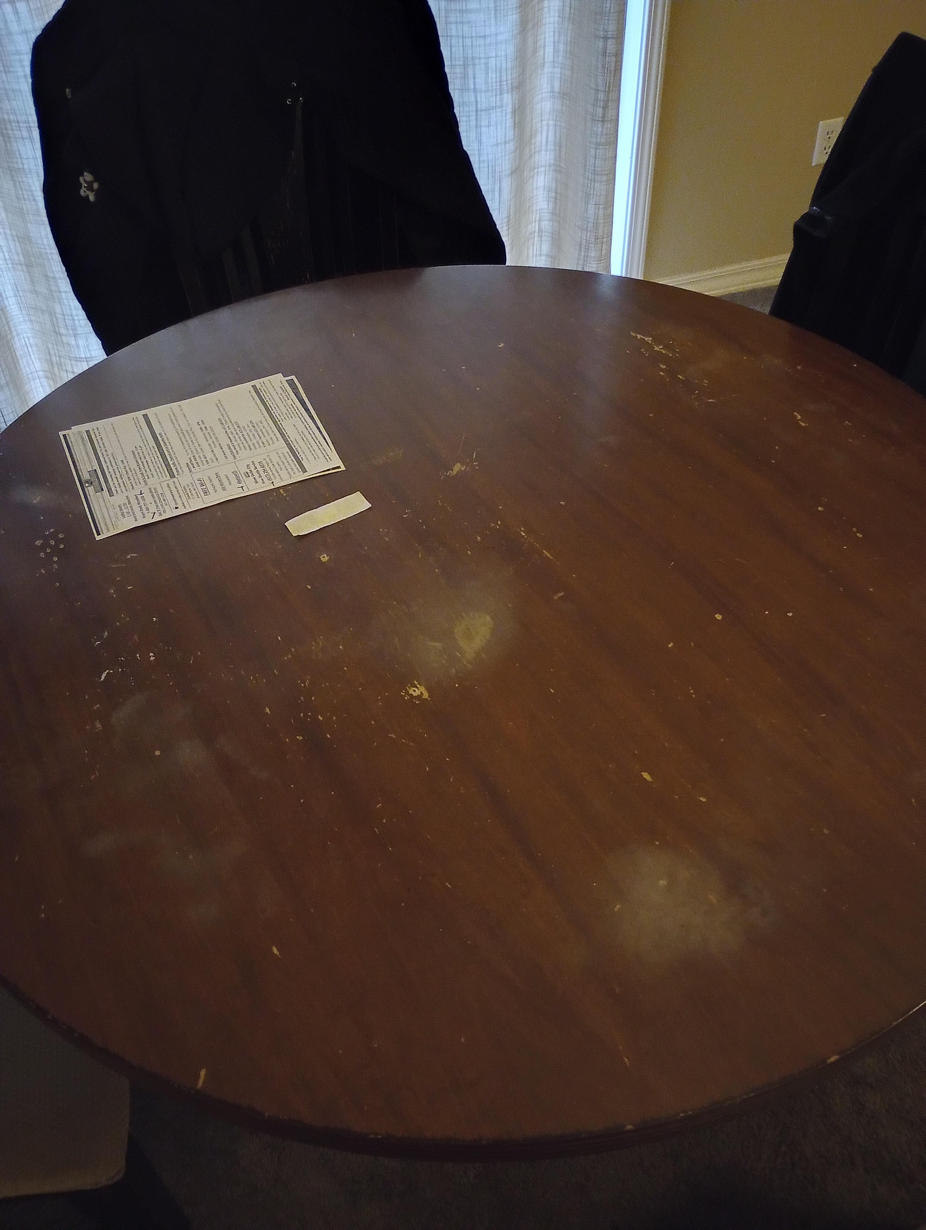 Dining table and chairs very old, stains, wood chipped, someone literally took a fork and put holes in it