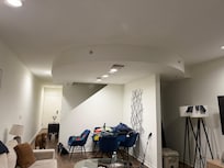 Rounded ceiling in which pictures demo clearly a squared ceiling