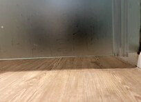 Glass partition for toilet open at the bottom, offering no privacy (not shown on hotel description)