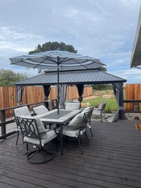 Lovely outdoor table, chairs and umbrella for outdoor dining.