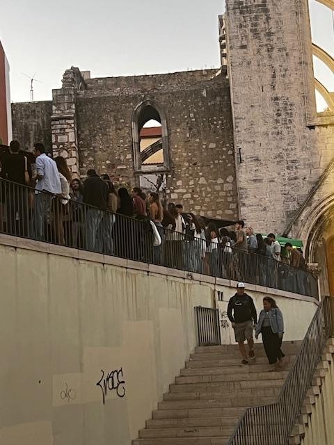 Hundreds of people at dance club next door taken from apartment window.