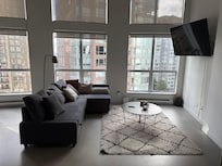 Our loungeroom in Condo with huge Tv to watch Netflix and Disney Apps