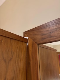 Wardrobe ill fitting and paper towel used to ad it against the mirror frame