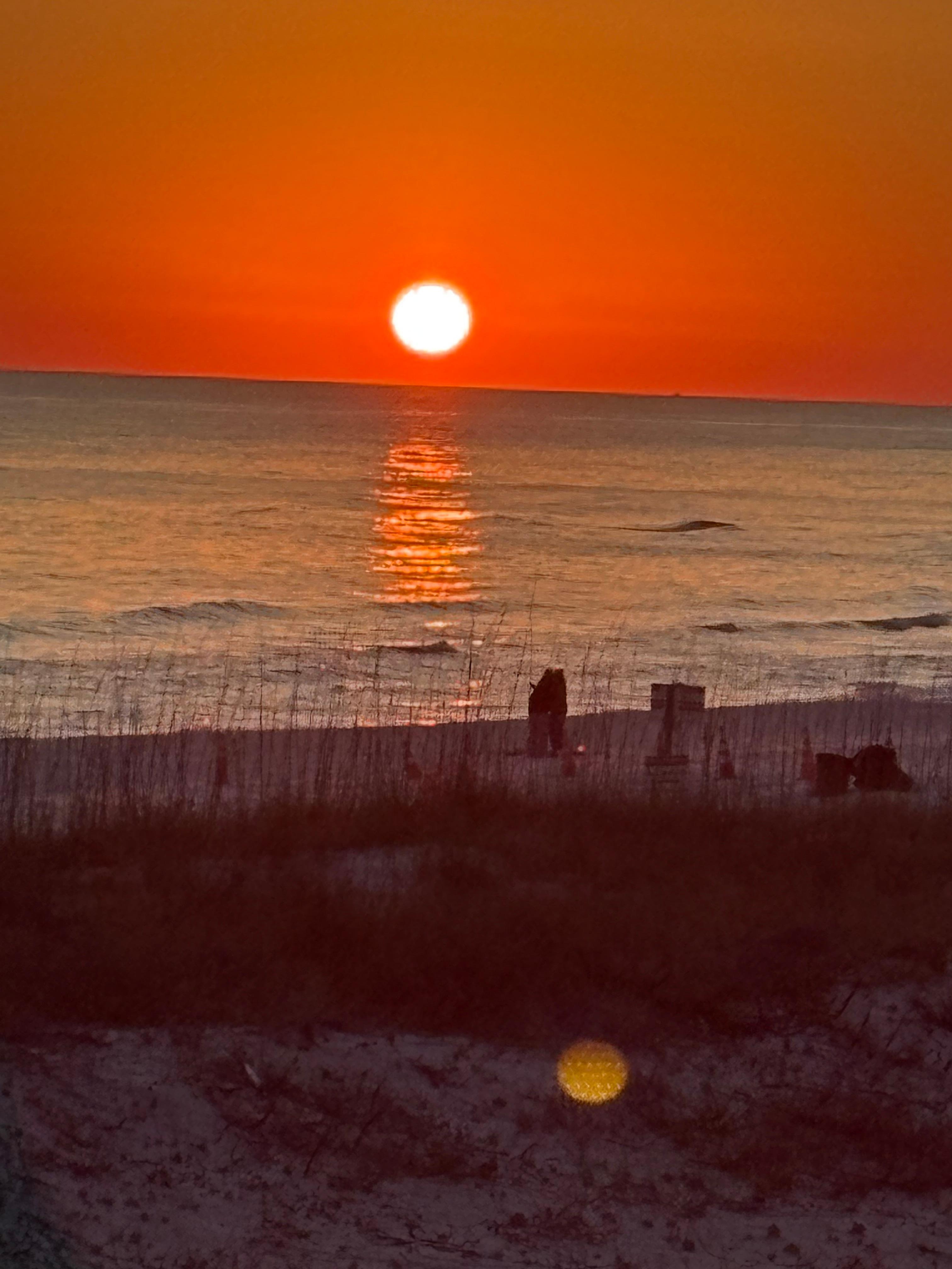 This was taken a little ways down the beach but you can watch the sunsets from the porch
