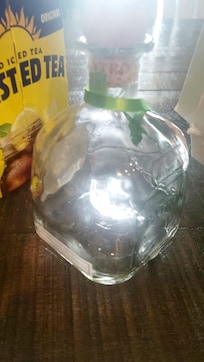 Empty bottle & box of liquor found in the cabinet
