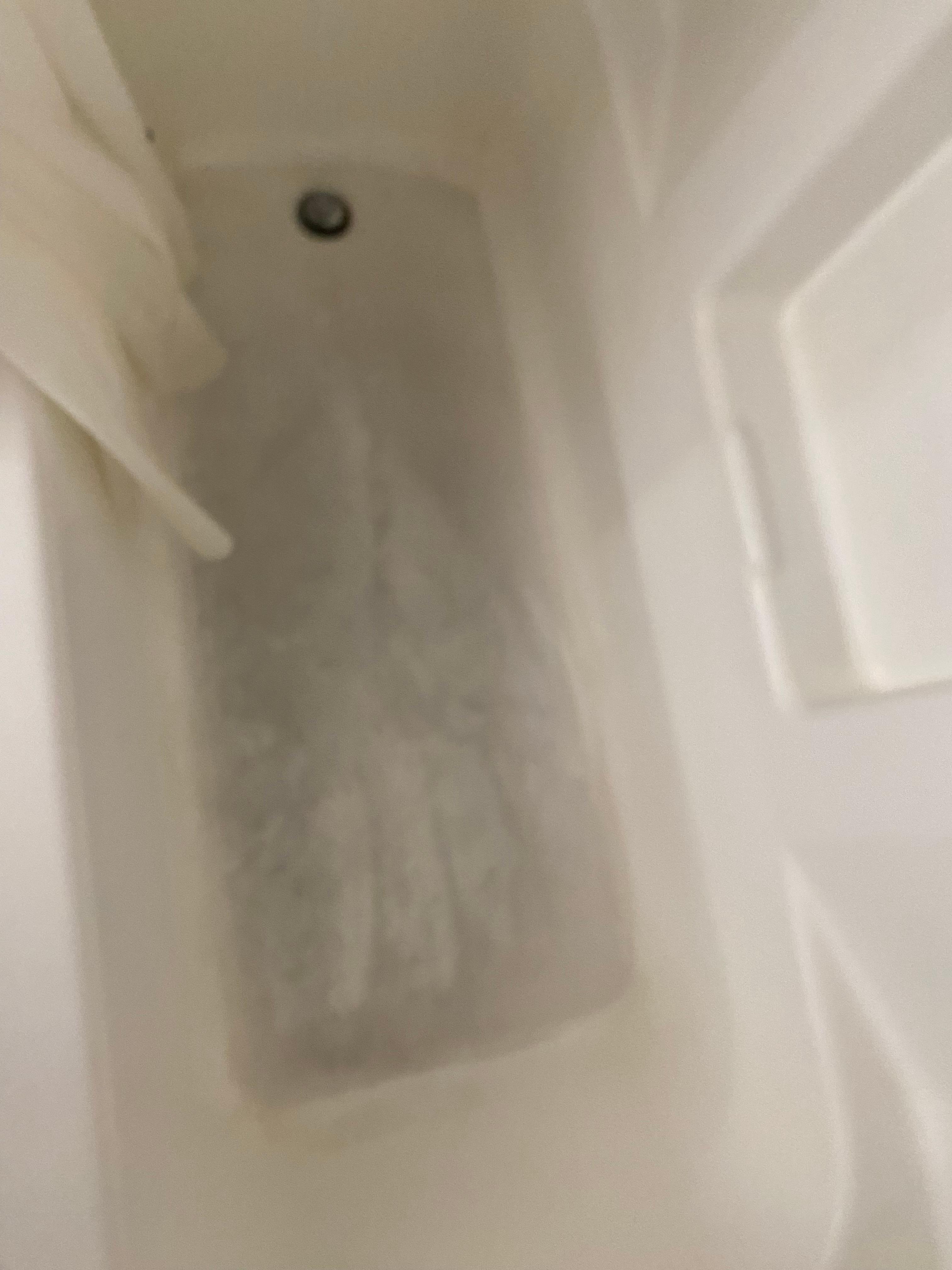 Second room: dirty stained tub.