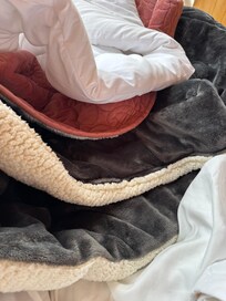 Layers of thick blankets on the comfortable bed kept us warm.