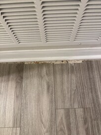 Flooring gaps and dirty baseboards
