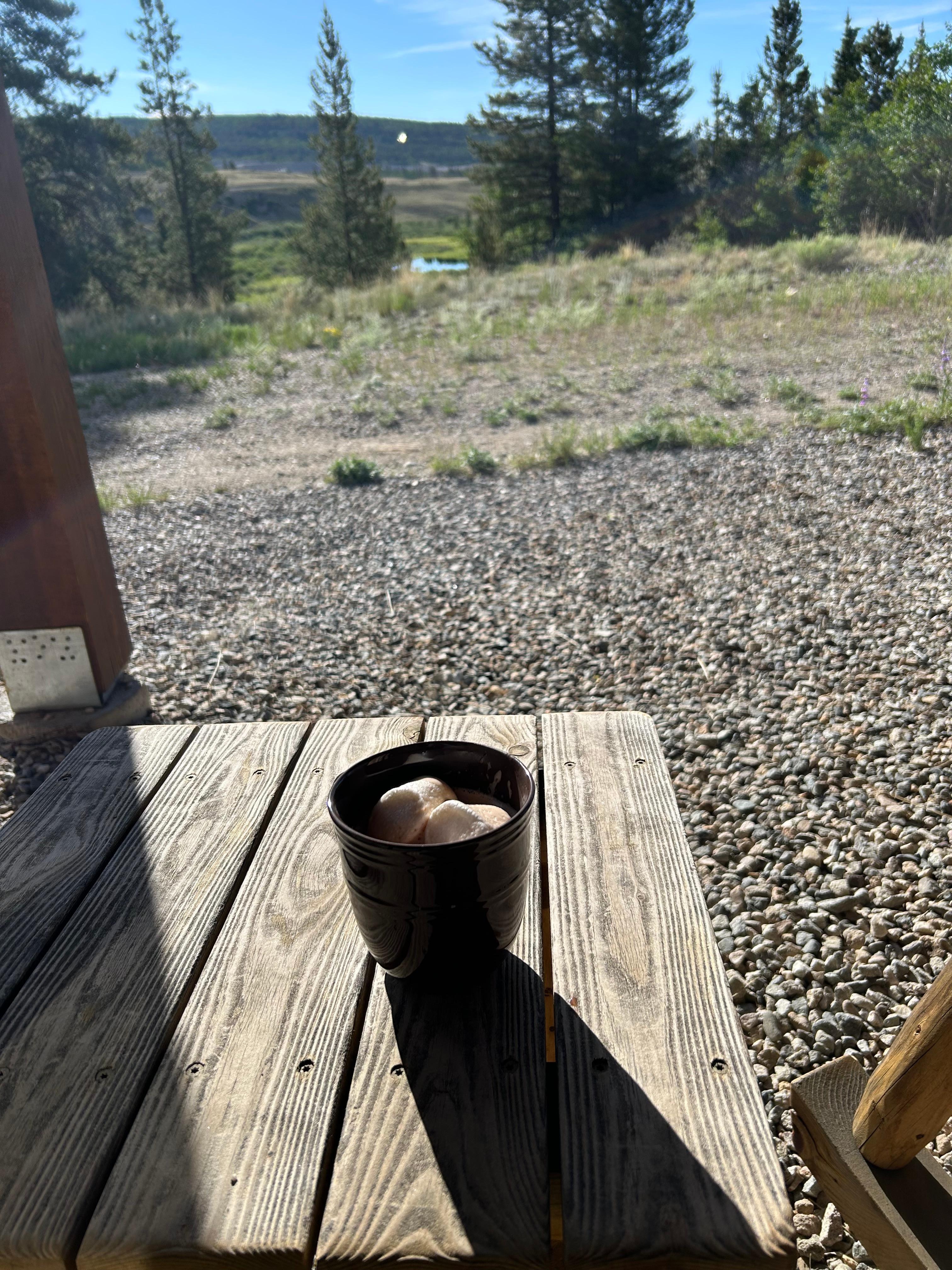Enjoying a cup of hot chocolate while taking in the view. 