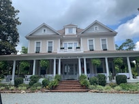 Front of B&B huge wrap around porch.