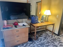 The rest of the room, with the upgraded TV. Huge smart TVs available  in all rooms!