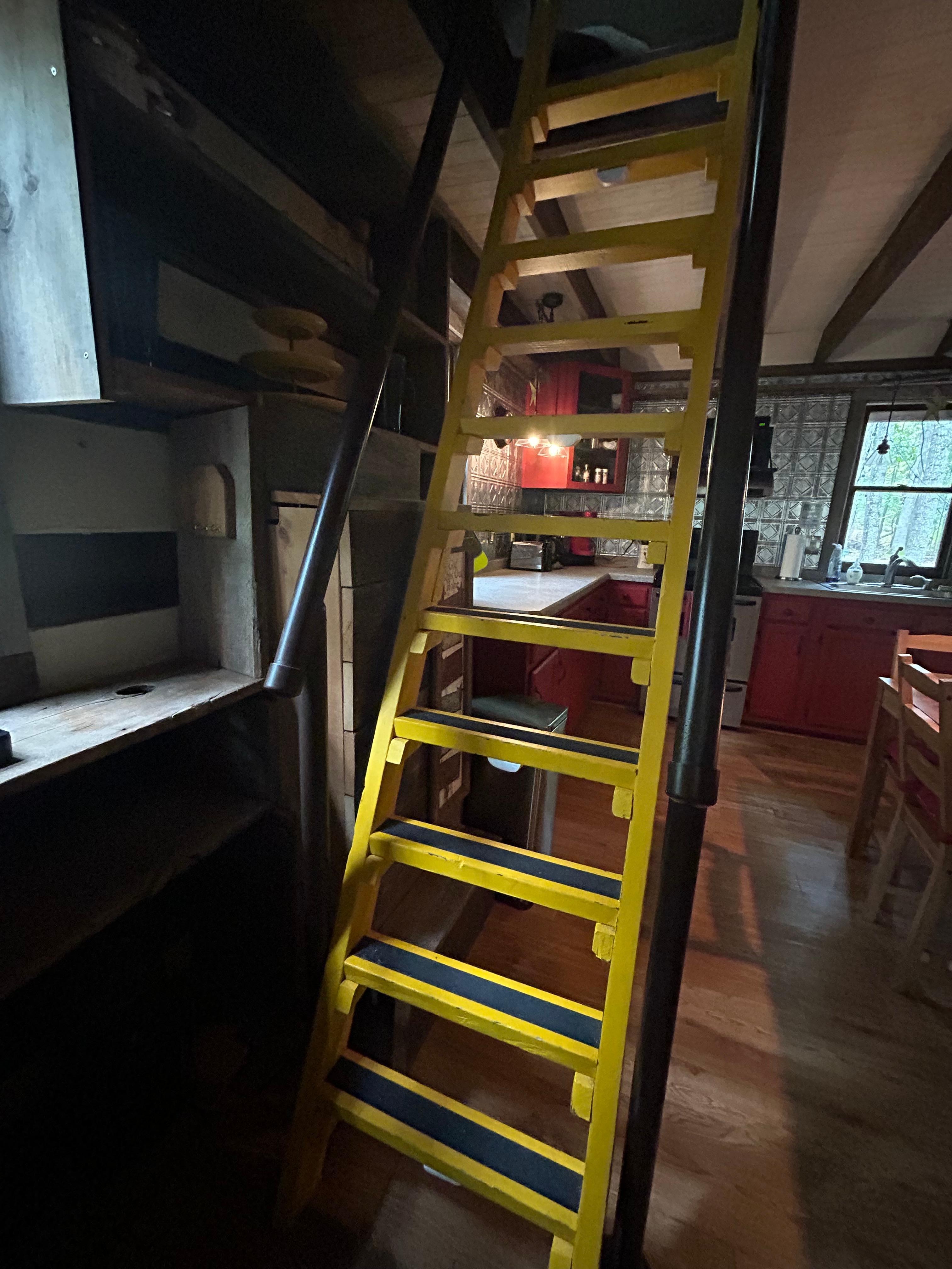 Steep ladder to access attic/loft bedroom