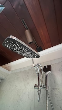 A track light IN the master shower, 5" above the shower head.