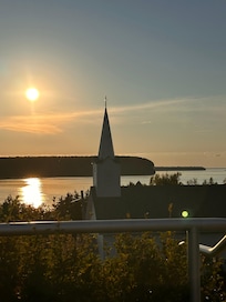 Sunset over the bay at top of steps.
