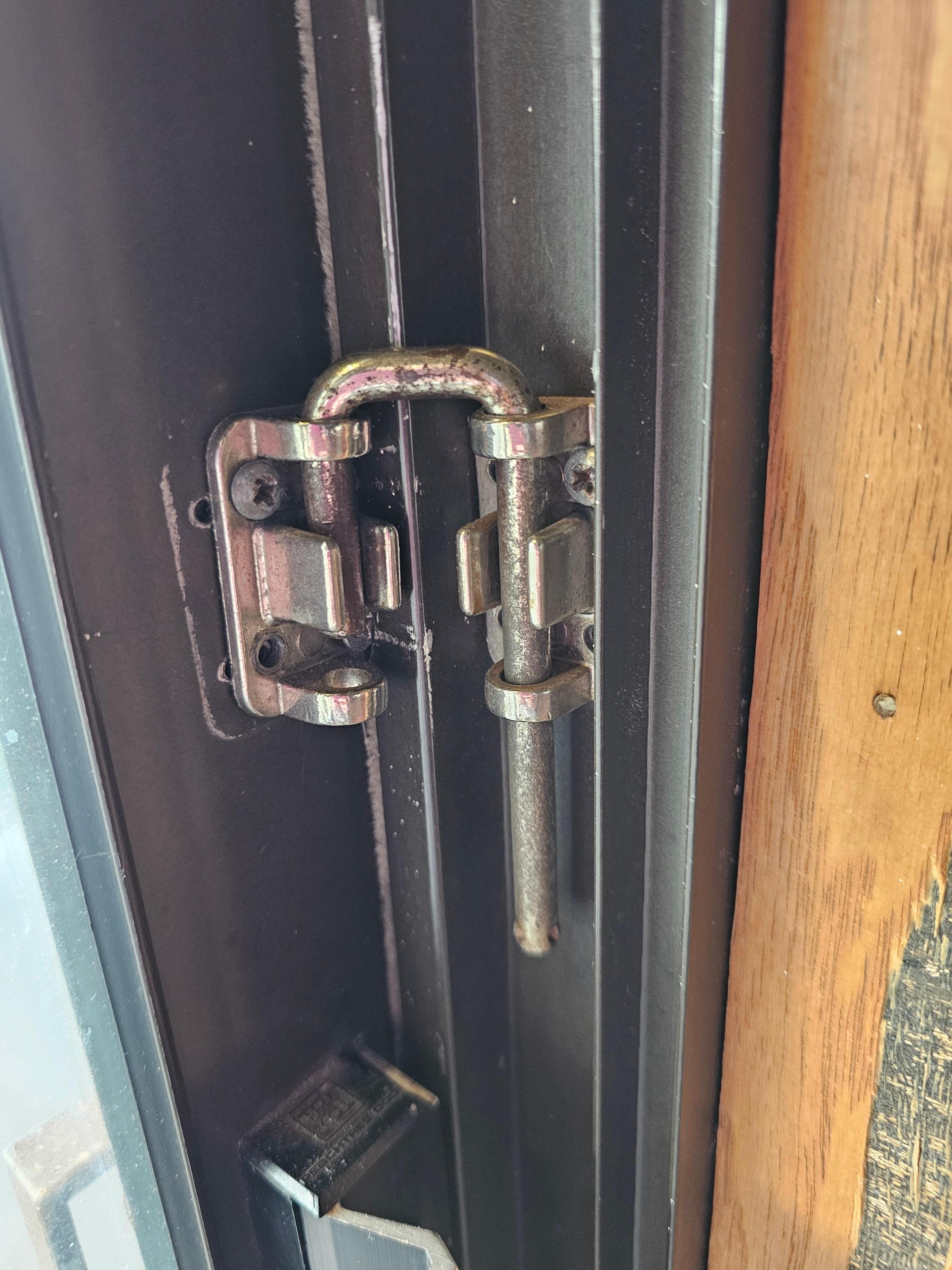 This is the makeshift fix for the sliding glass door. The picture above, shows another angle of how far the door still opens even with this on. Can easily be picked open. 