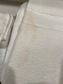 Bath towel with large stain