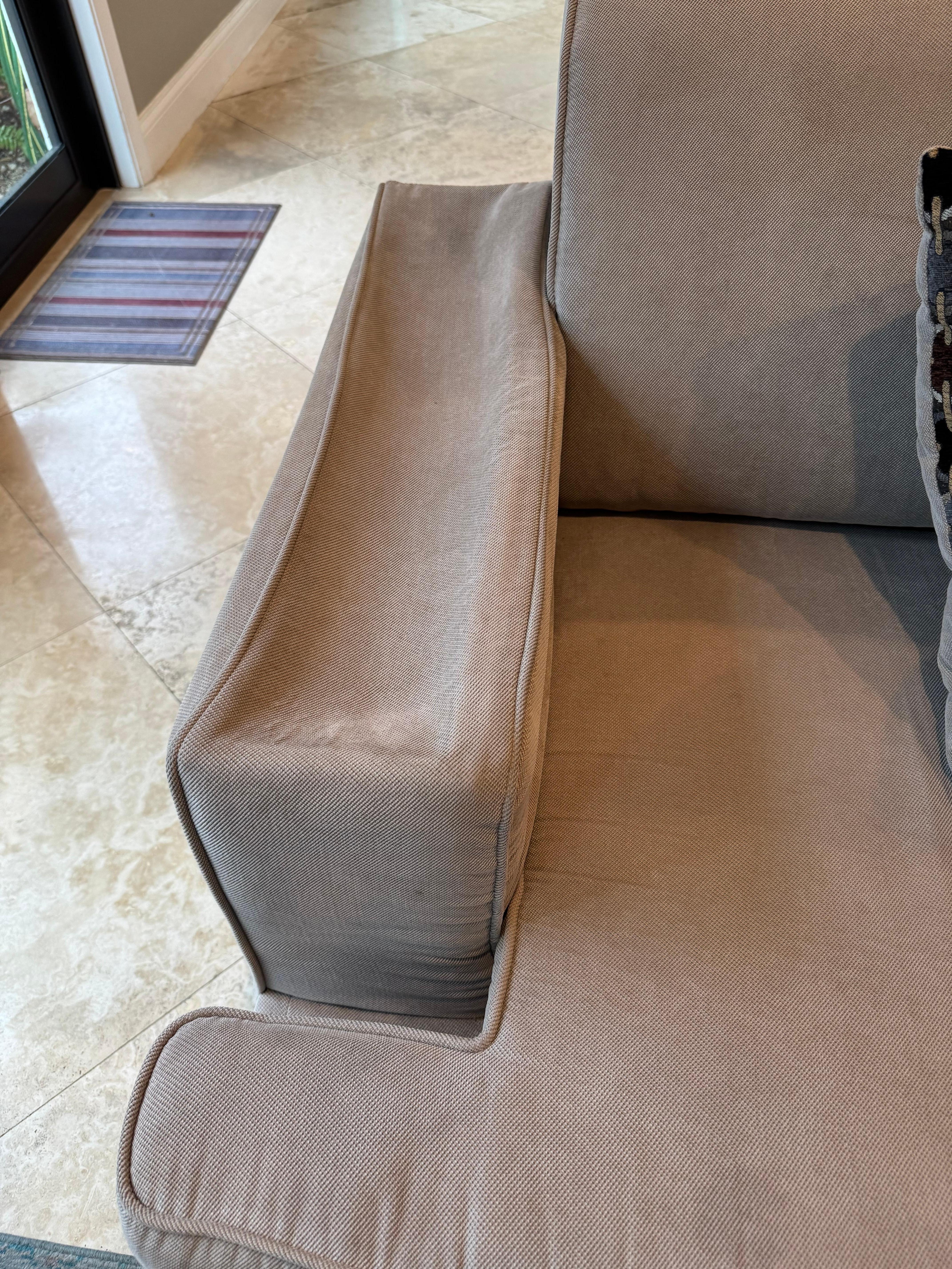 Here is the sofa with missing arm cushioning