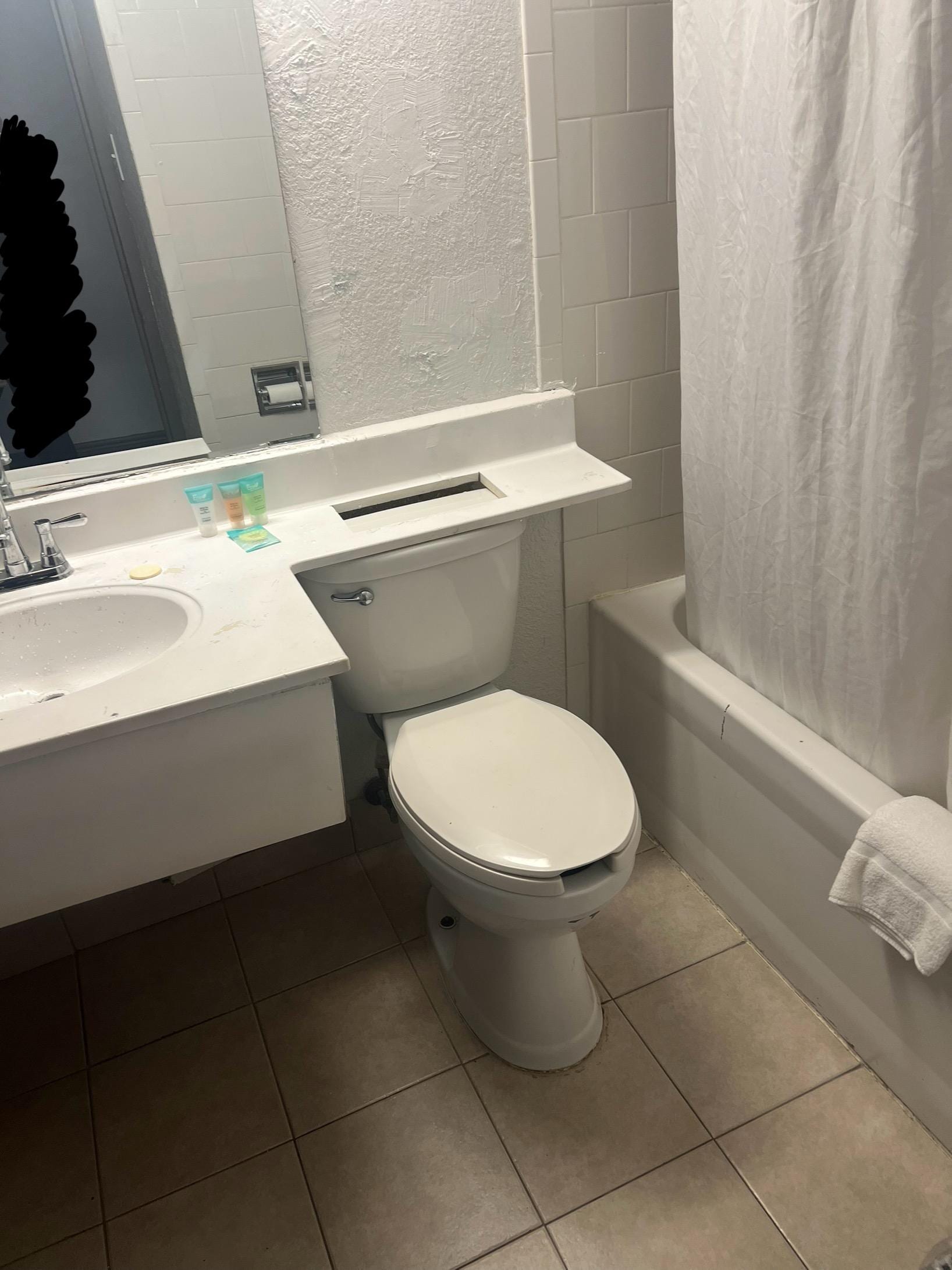 Paint stains on sink and on toilet seat, soap was already opened