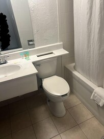 Paint stains on sink and on toilet seat, soap was already opened