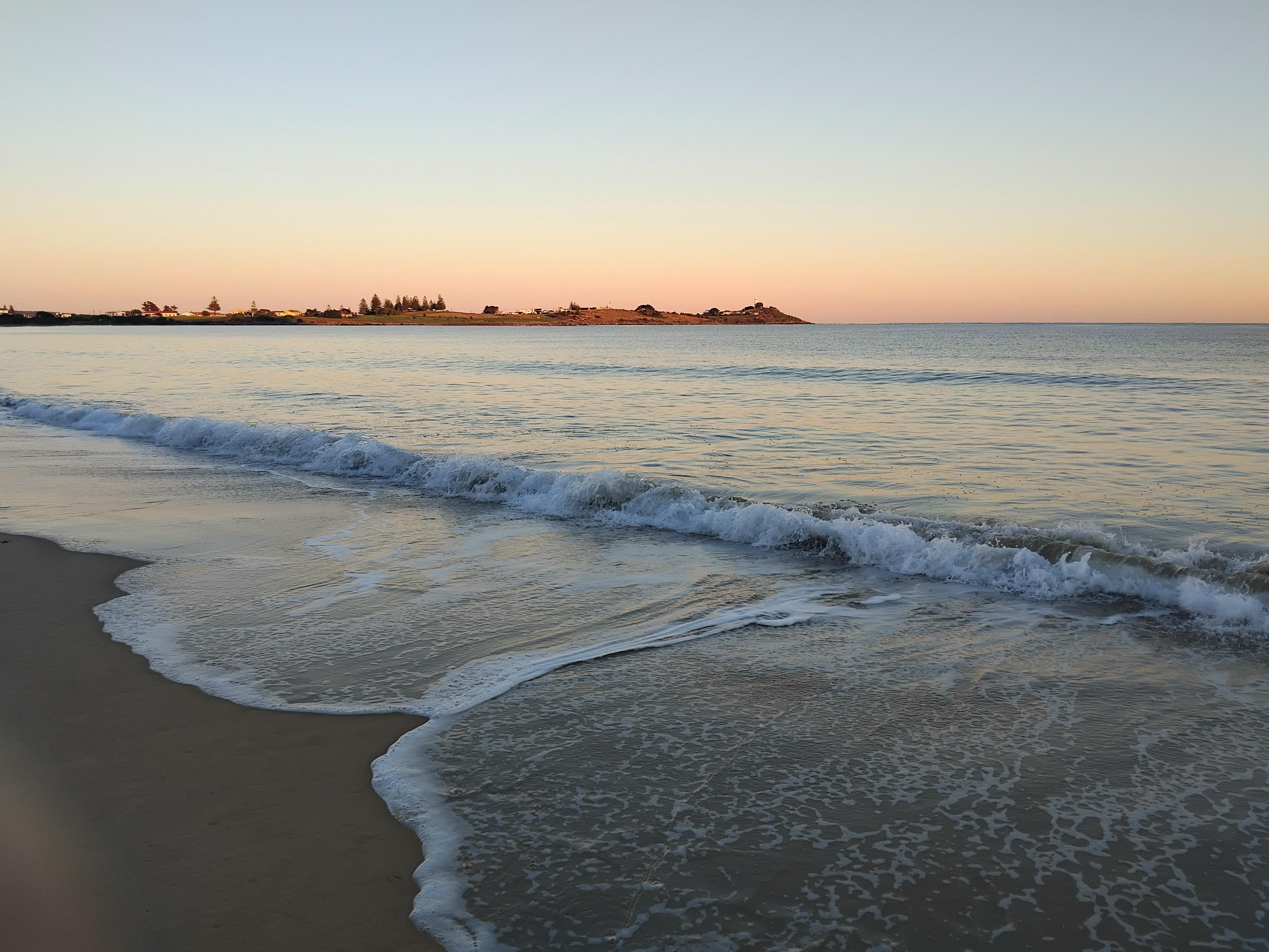An early morning stroll along the beach at sunrise.