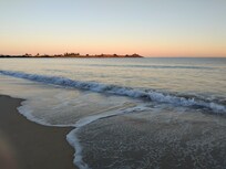 An early morning stroll along the beach at sunrise.