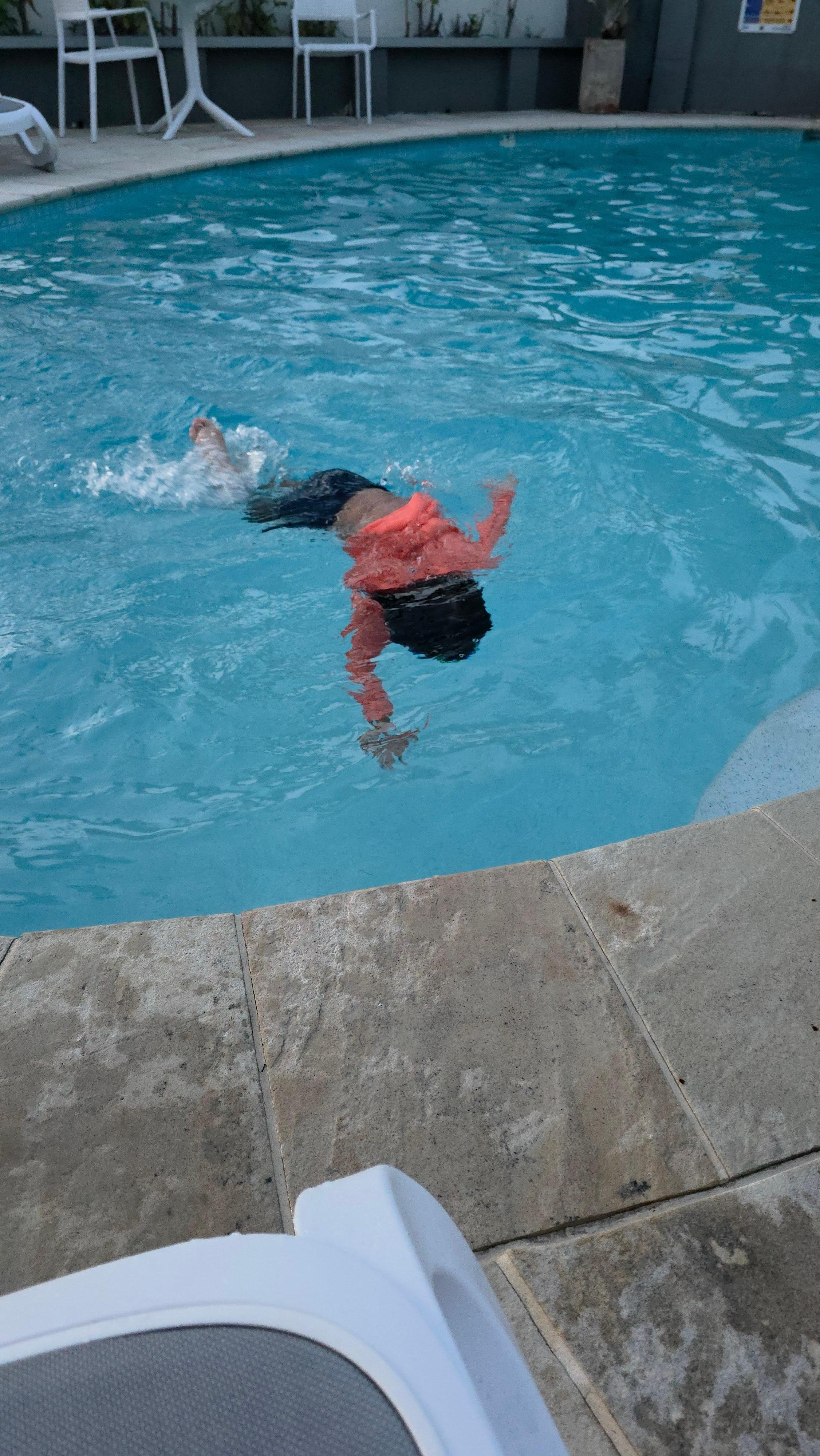 Enjoying one of his many swims in the pool