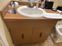 The bathroom with a toddler sized toilet.