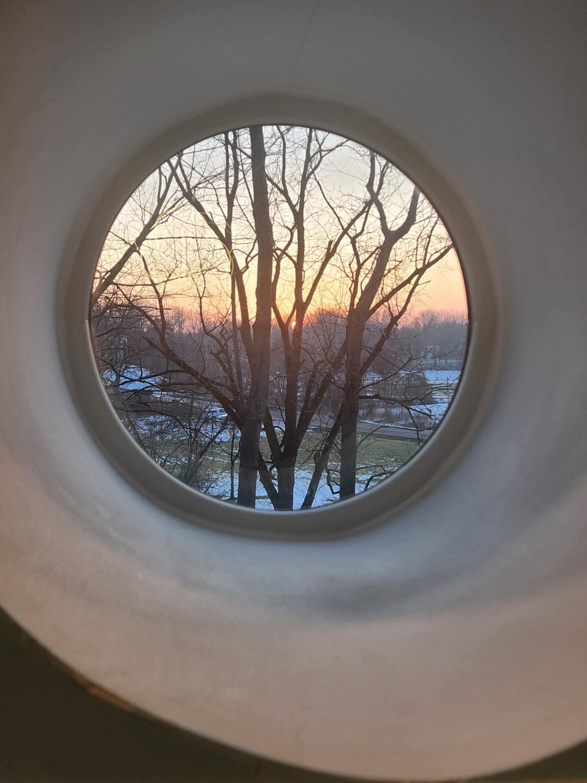 Watching the sunset through one of the kitchen windows.