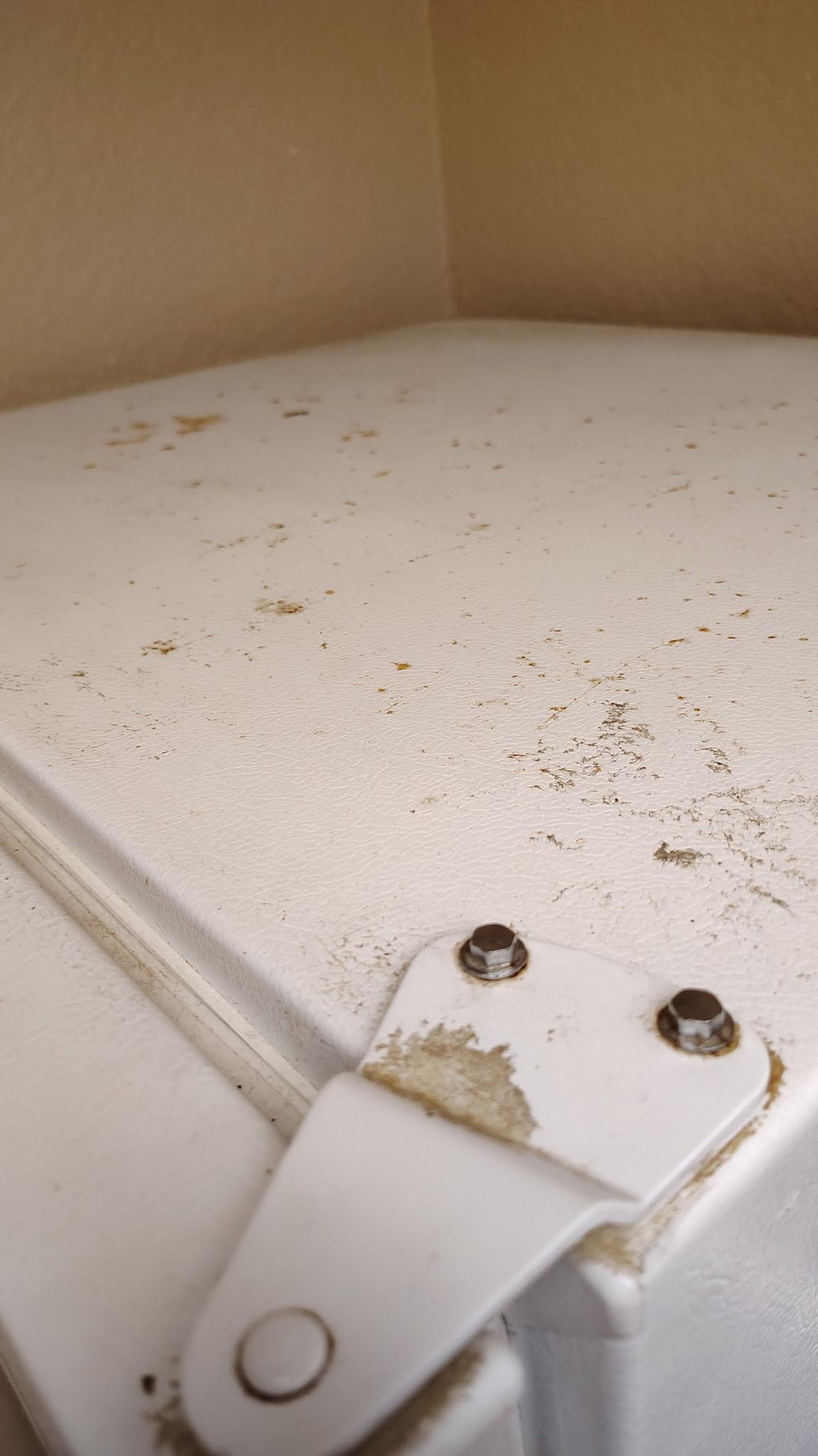 Top of refrigerator, dusty, and dust falling down