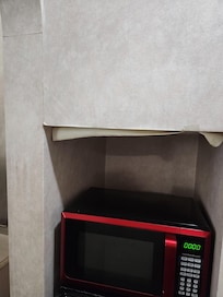 Peeling wallpapee above microwave