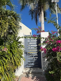 Beautiful flowers along entry and locked for safety. Easy code entry