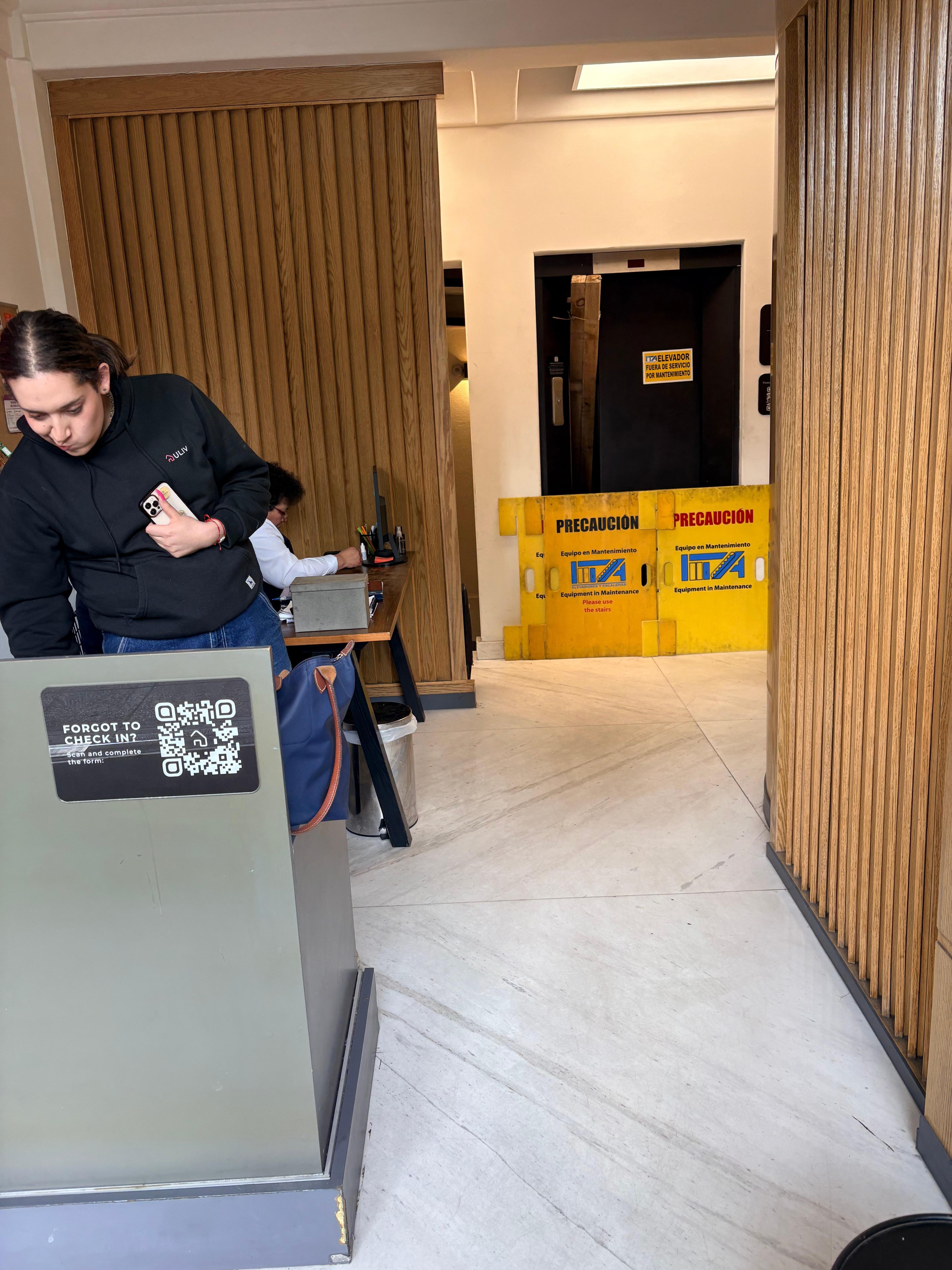 Lobby entrance with broken elevator. 