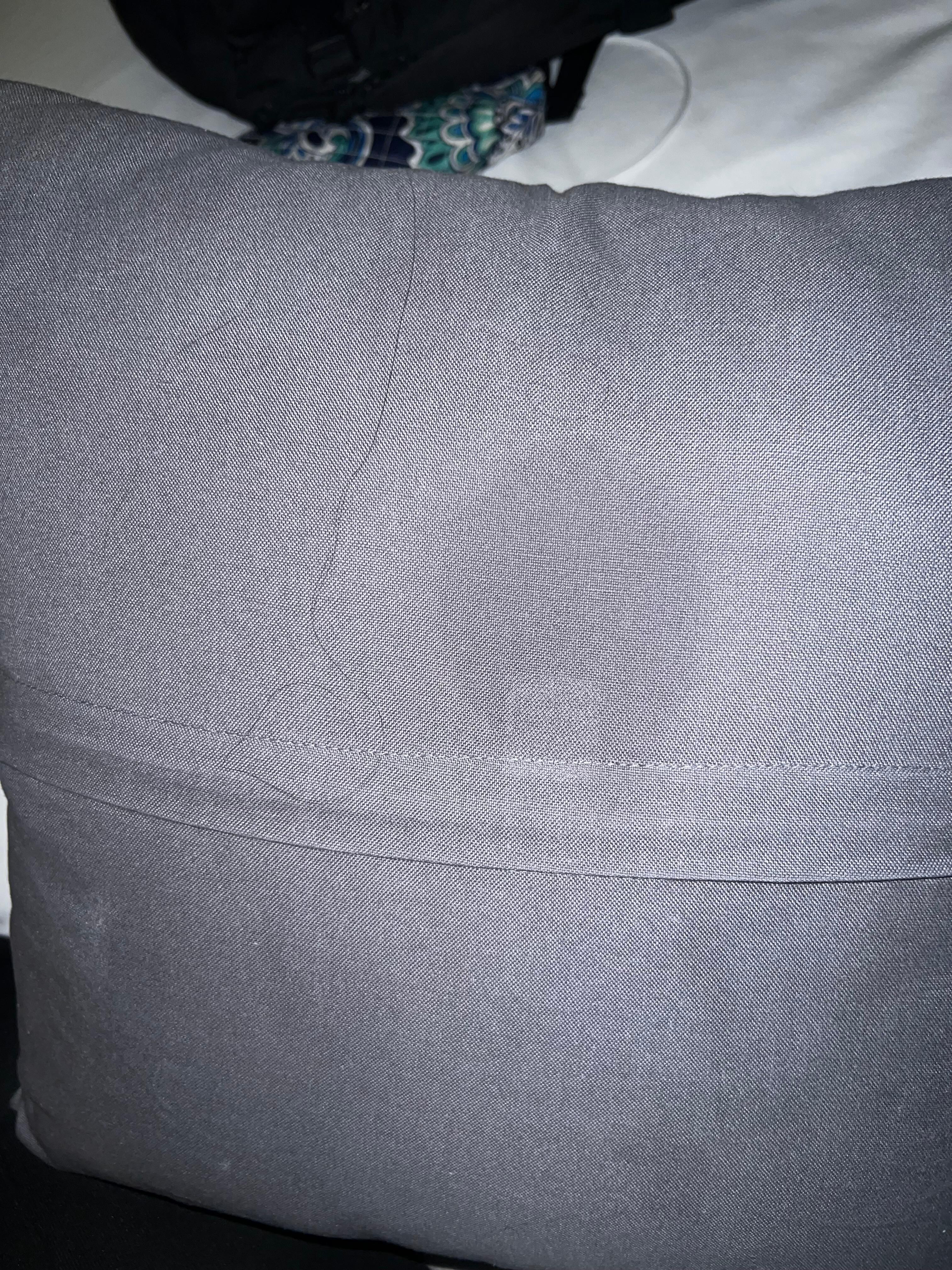 The decor pillow had questionable greasy stains and another guest’s hair behind it on the side touching the linens where we sleep.