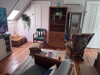 The upstairs bedroom was enormous! The bed was so comfortable, and the splitter worked so well that I even had to steal a blanket back from my boyfriend because my toes got cold. Wonderful!