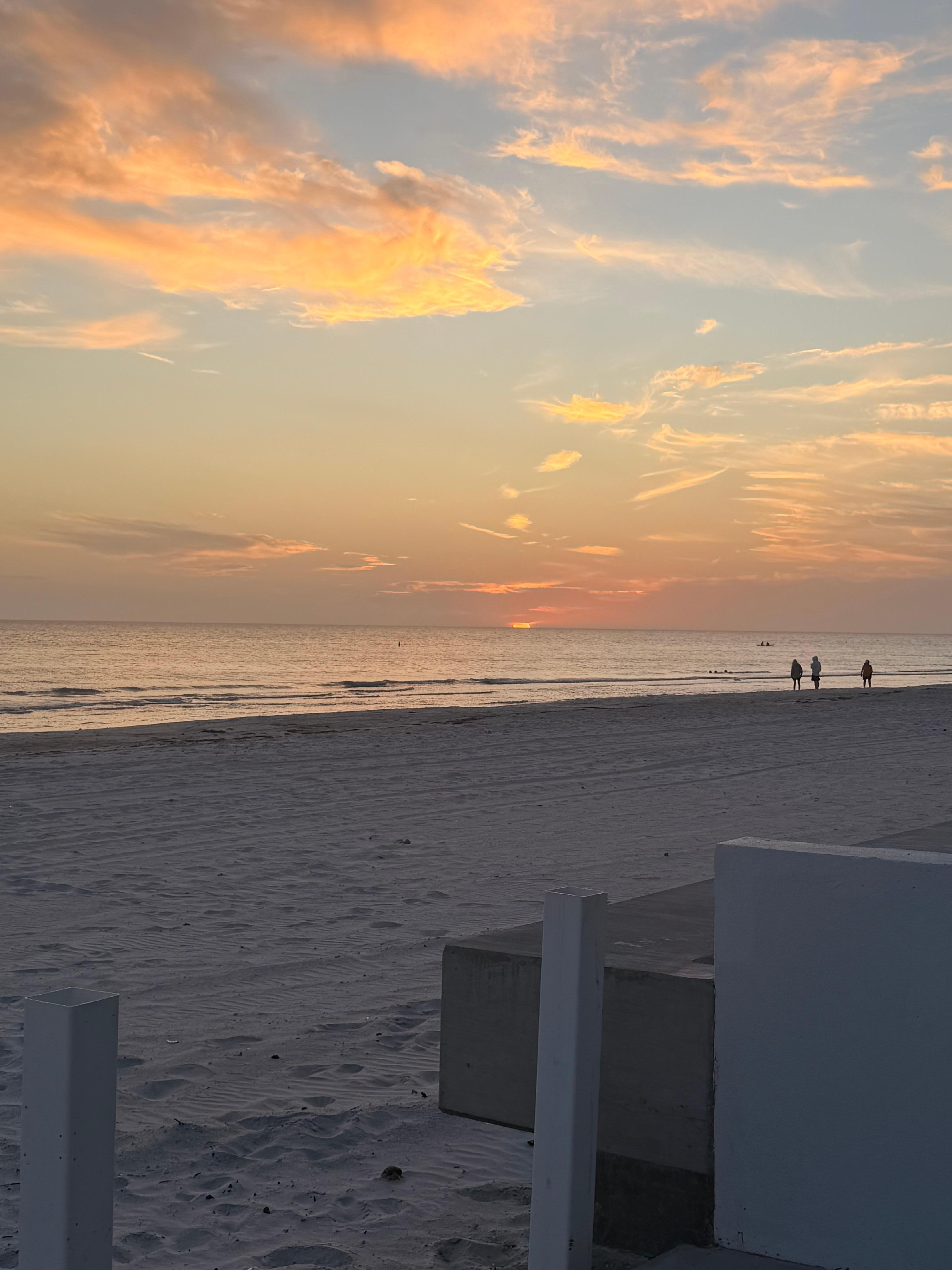 Standing on the pickleball court at sunset. 