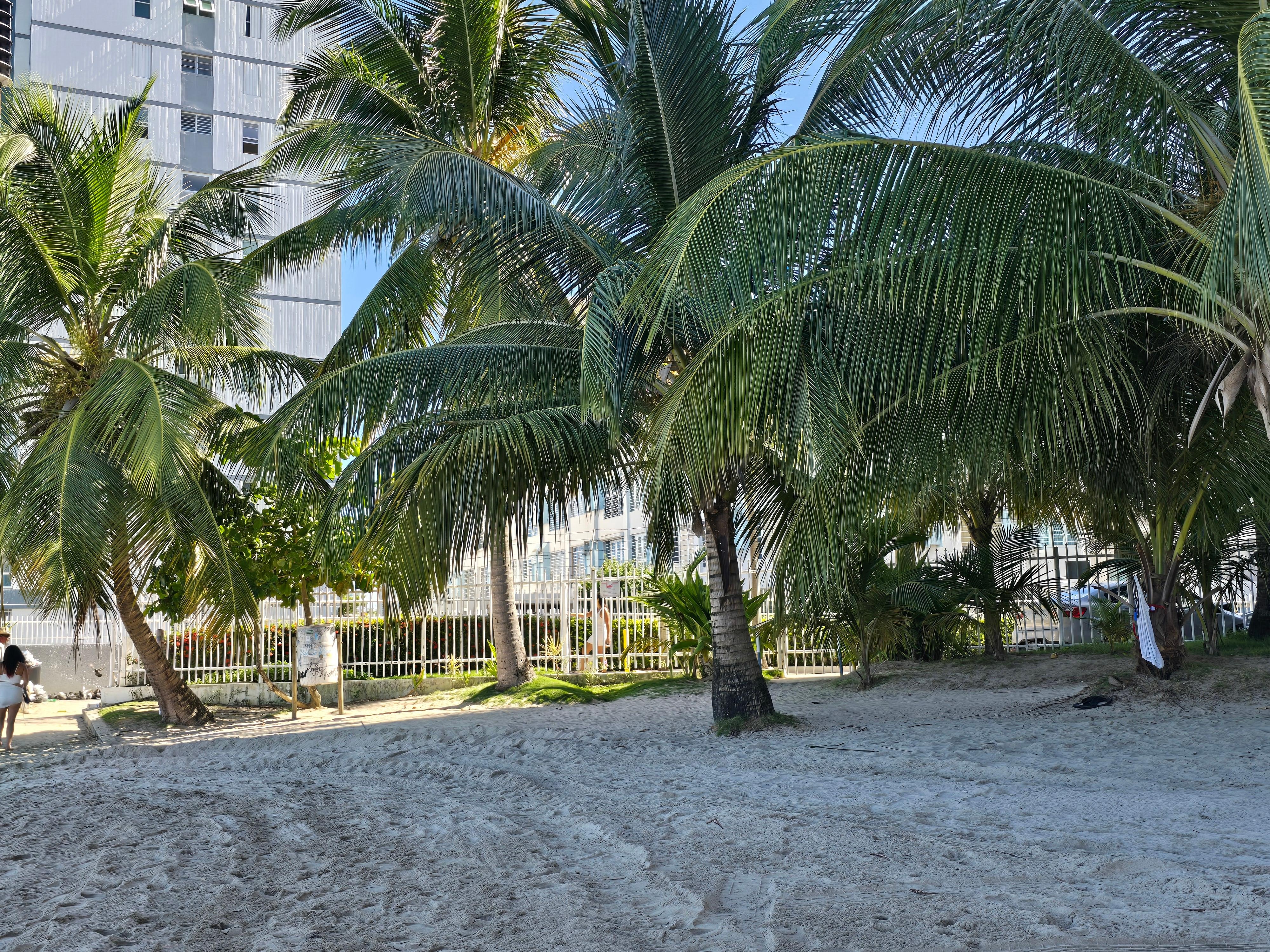 The Cute Beach Studio building is with the blue box air condition coverings.