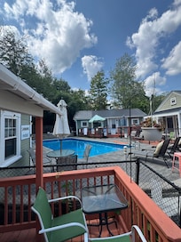 Small patio to our cottage with pool right next to us