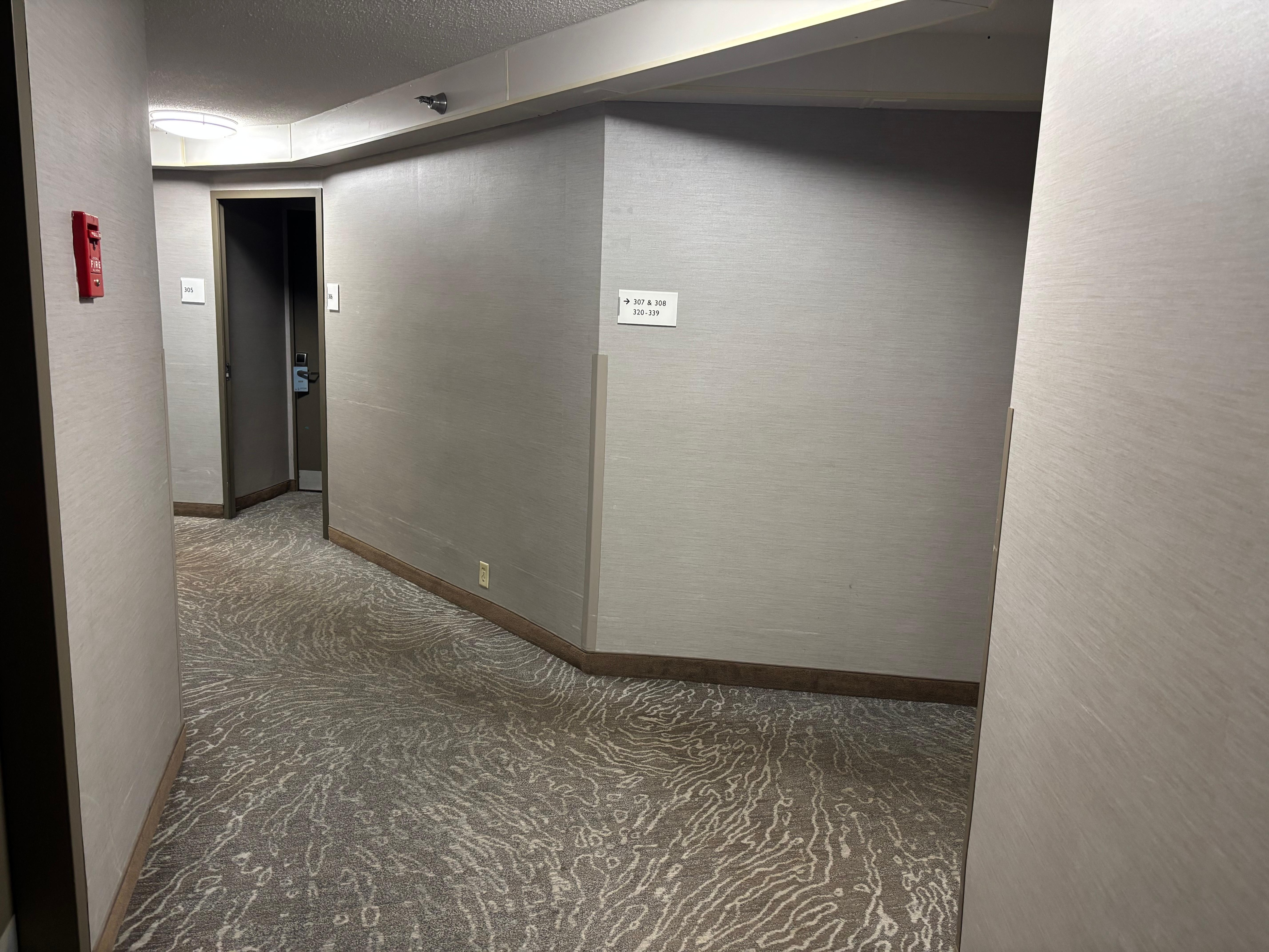 Carpet issues like this were common in the hallway. 