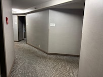 Carpet issues like this were common in the hallway.