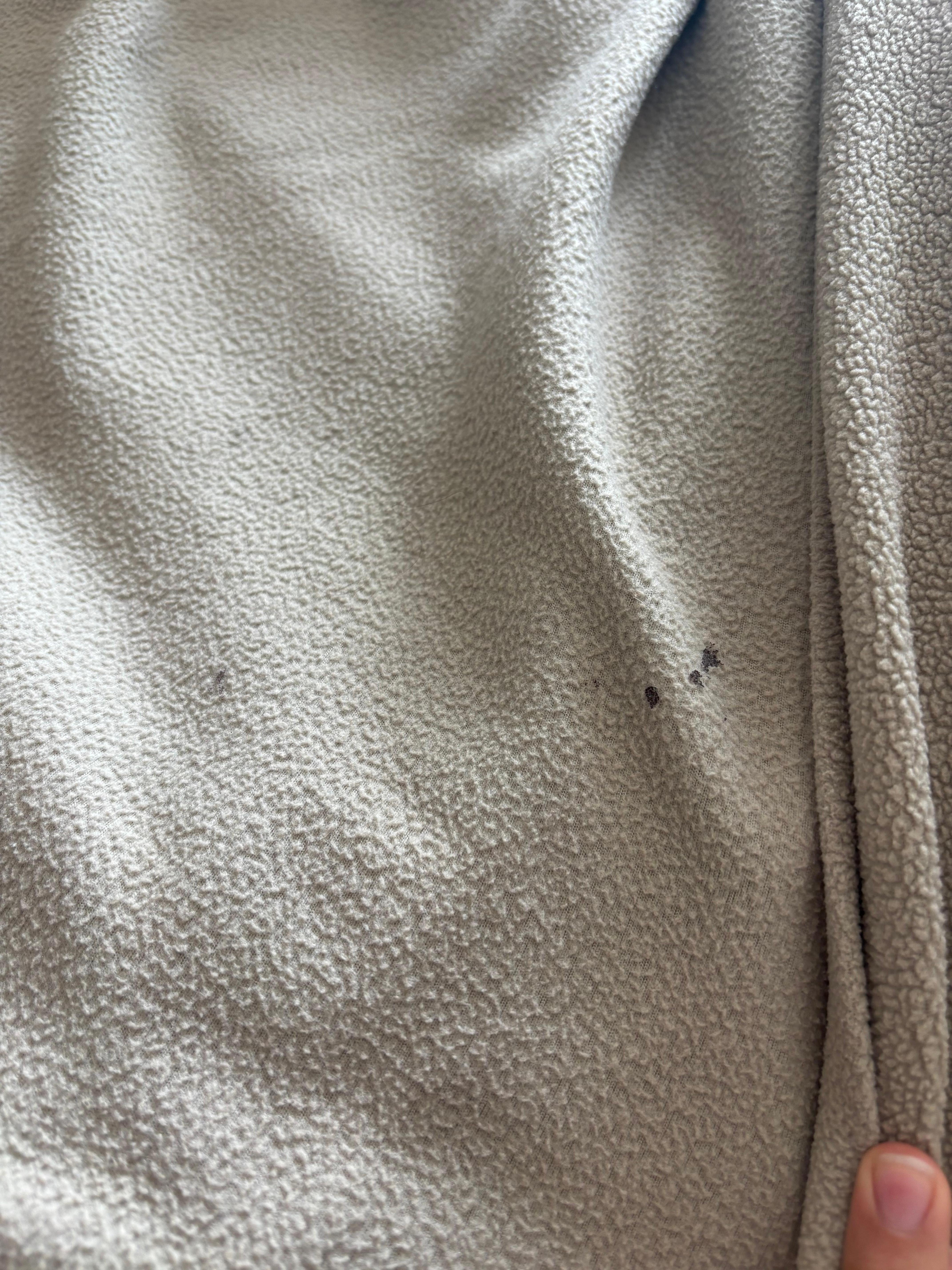 Old stains/dried sticky residue on bottom blanket.
