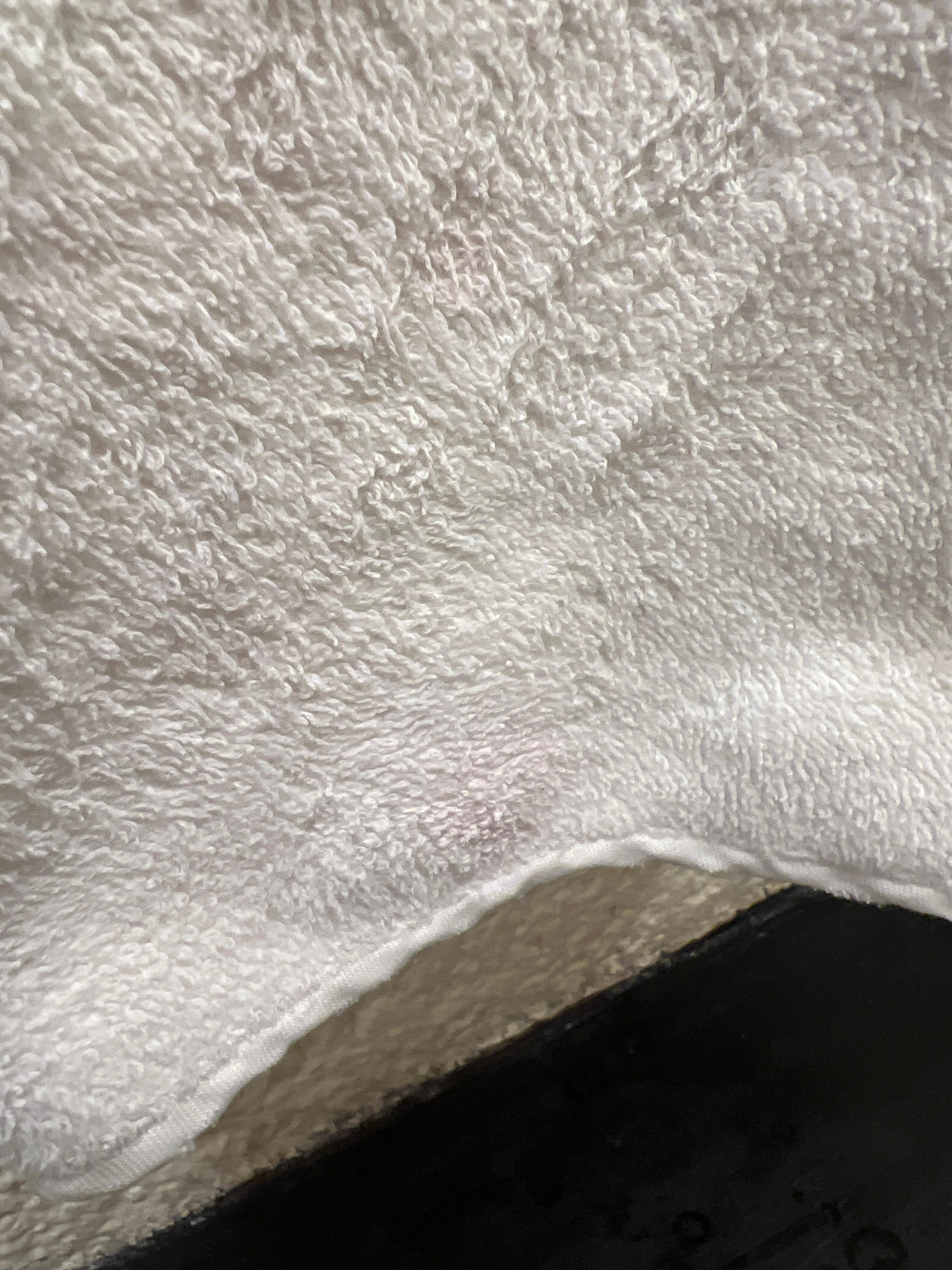 Toothpaste on hand towel.