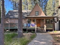 The front view. of the house with the BBQ and Spa on the left side. Contrary to what this site says, there is no washer / dryer at this home.