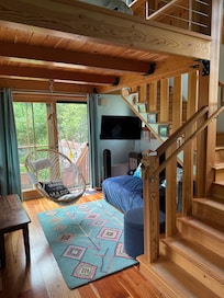 Inside nook and swing with French doors leading to the garden