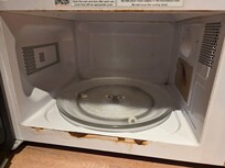Filthy microwave. Rusted. Moldy. Old and unhealthy. Disgusting.