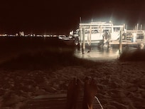 Relax in the evening on the private beach with lounge chairs.