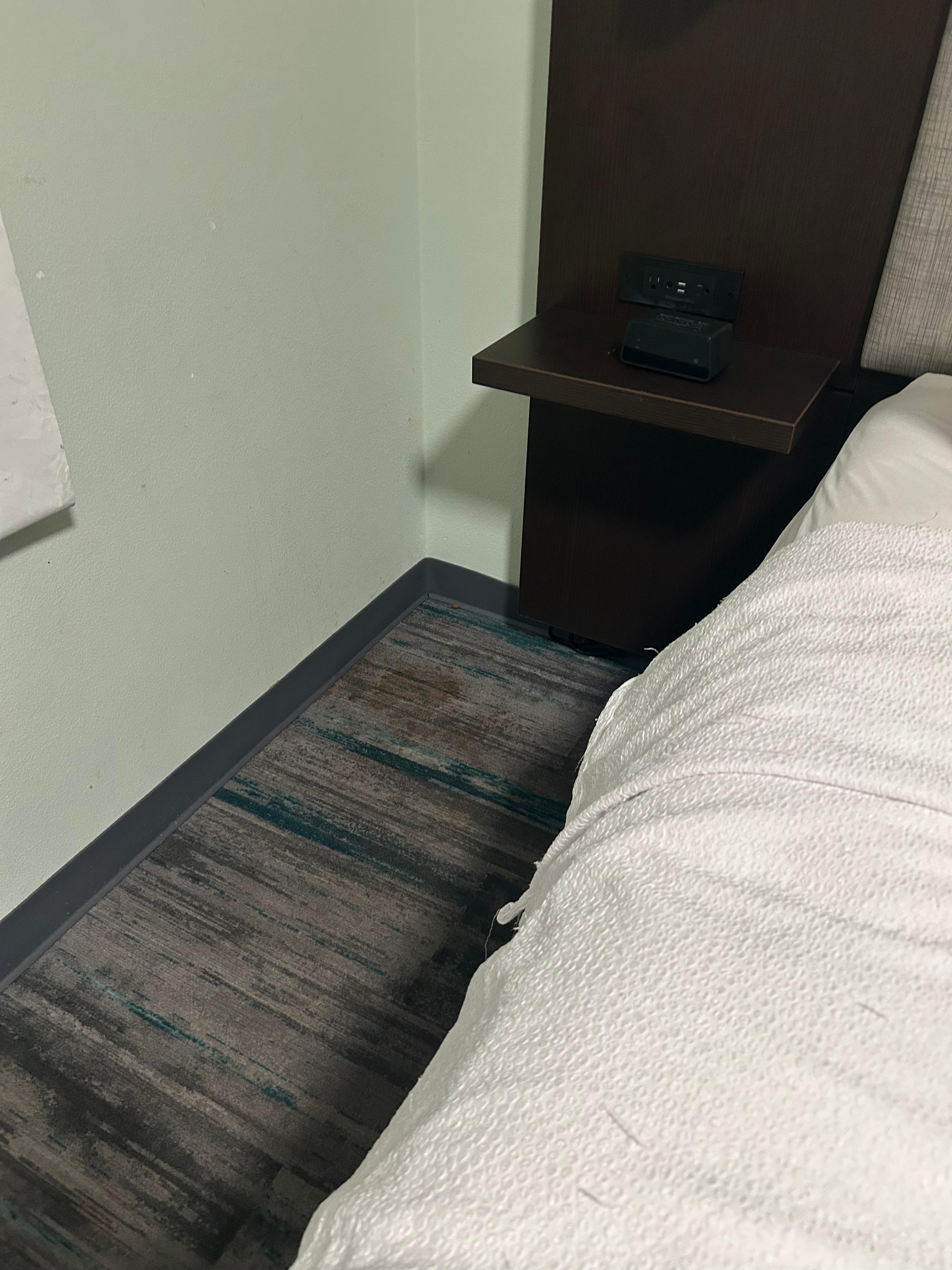 Blood stains beside bed, very clear the closer you zoom in. So disgusting and I was staying with my daughter and her friend.